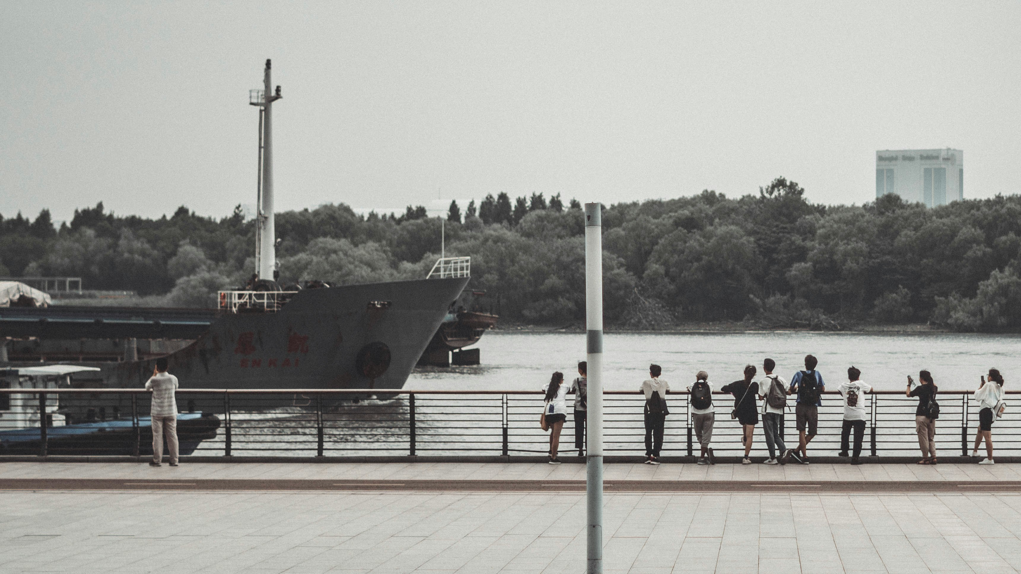people standing on dock during daytime